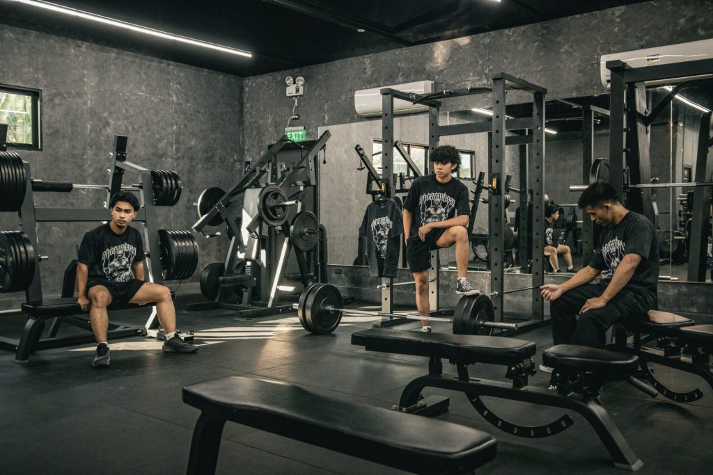 A group of men sitting in a gym
